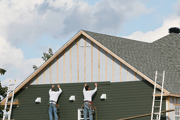 Professional Siding technician working in Long Creek, IL